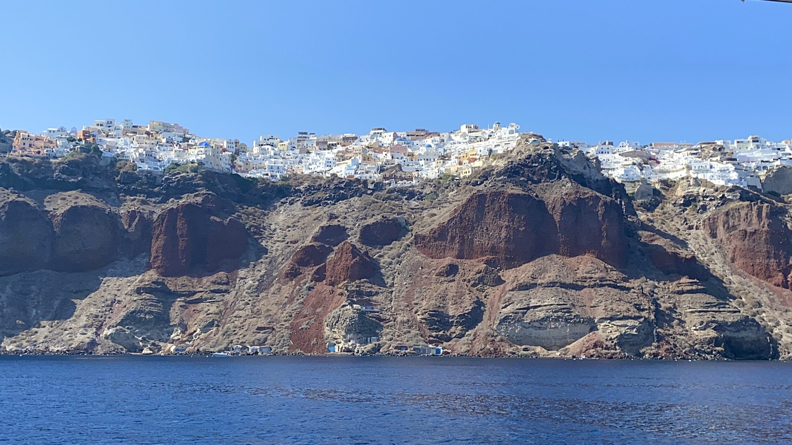 Oia, Santorini from the Mediterranean, copyright Amour Abroad 2021