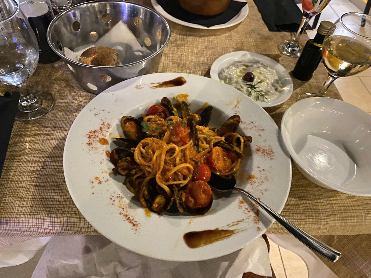 Kayla's seafood linguine dinner in Santorini on Amour Abroad