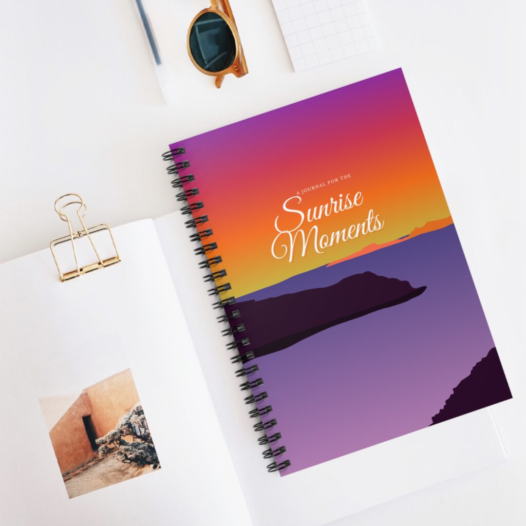 Displaying to buyers Amour Abroad's custom designed Sunrise Moments journal to help you call in change and surprises from the Universe