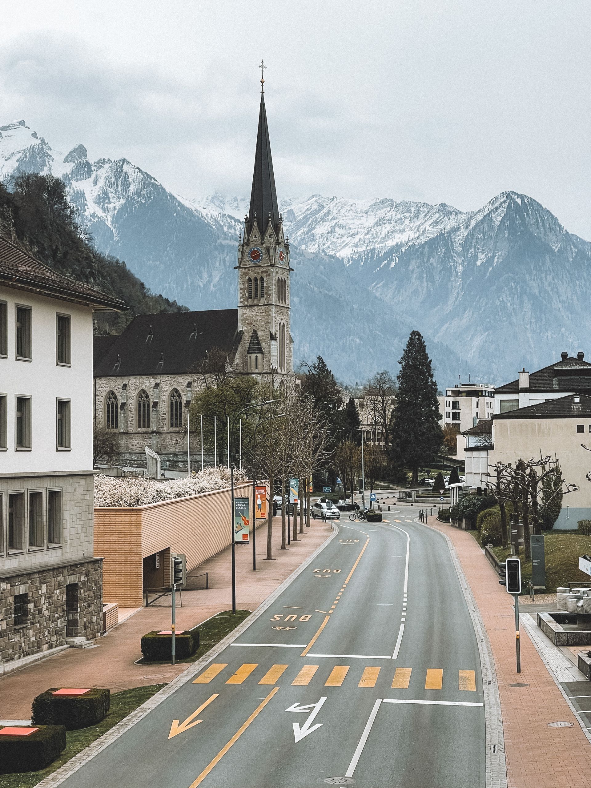 Beautful view of Vaduz Cathedral with the snowcapped Alps, in Vaduz, Liechtenstein.