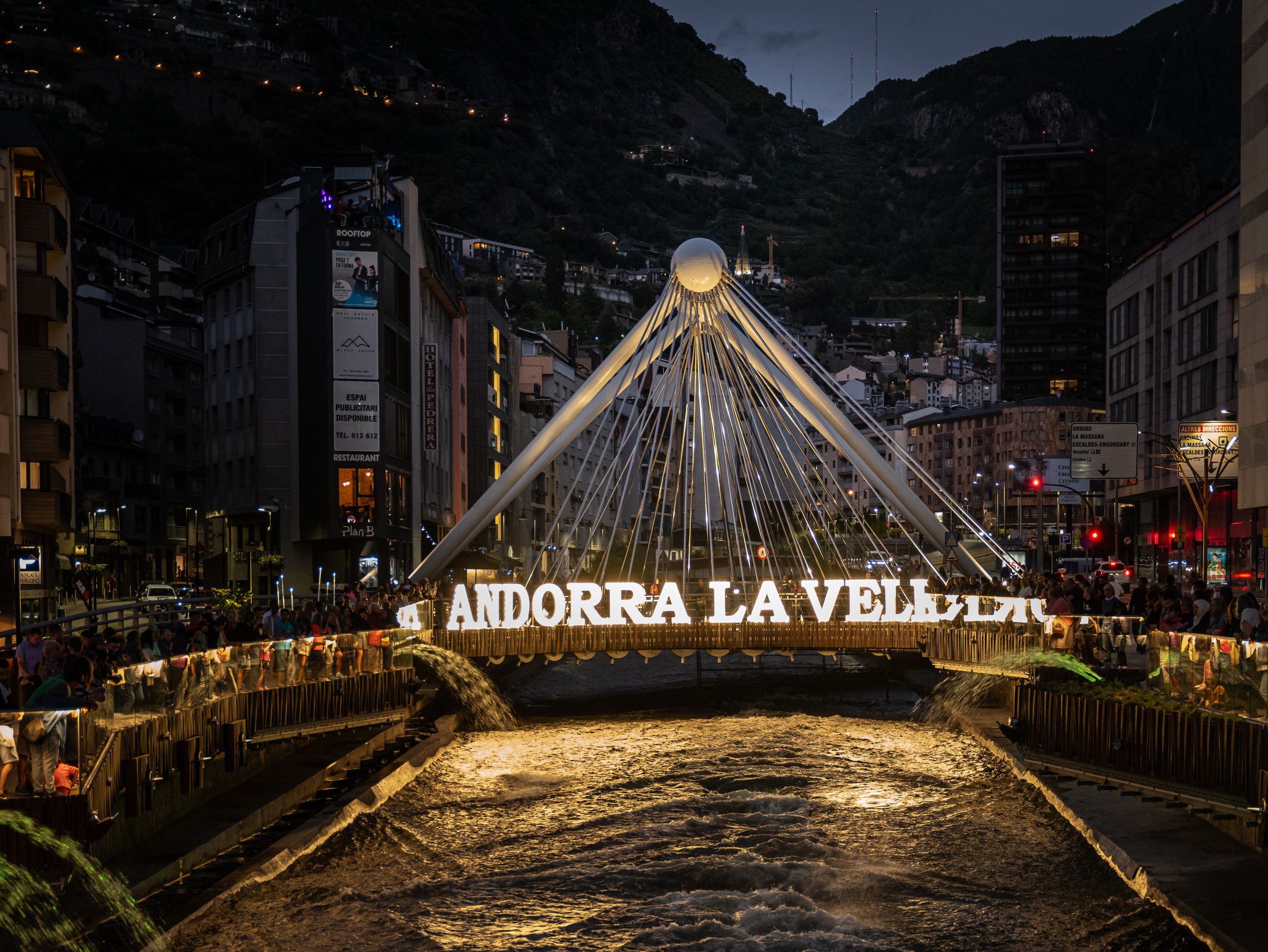 Beautiful evening view of the illuminated Pont de Paris bridge in Andorra la Vella.
