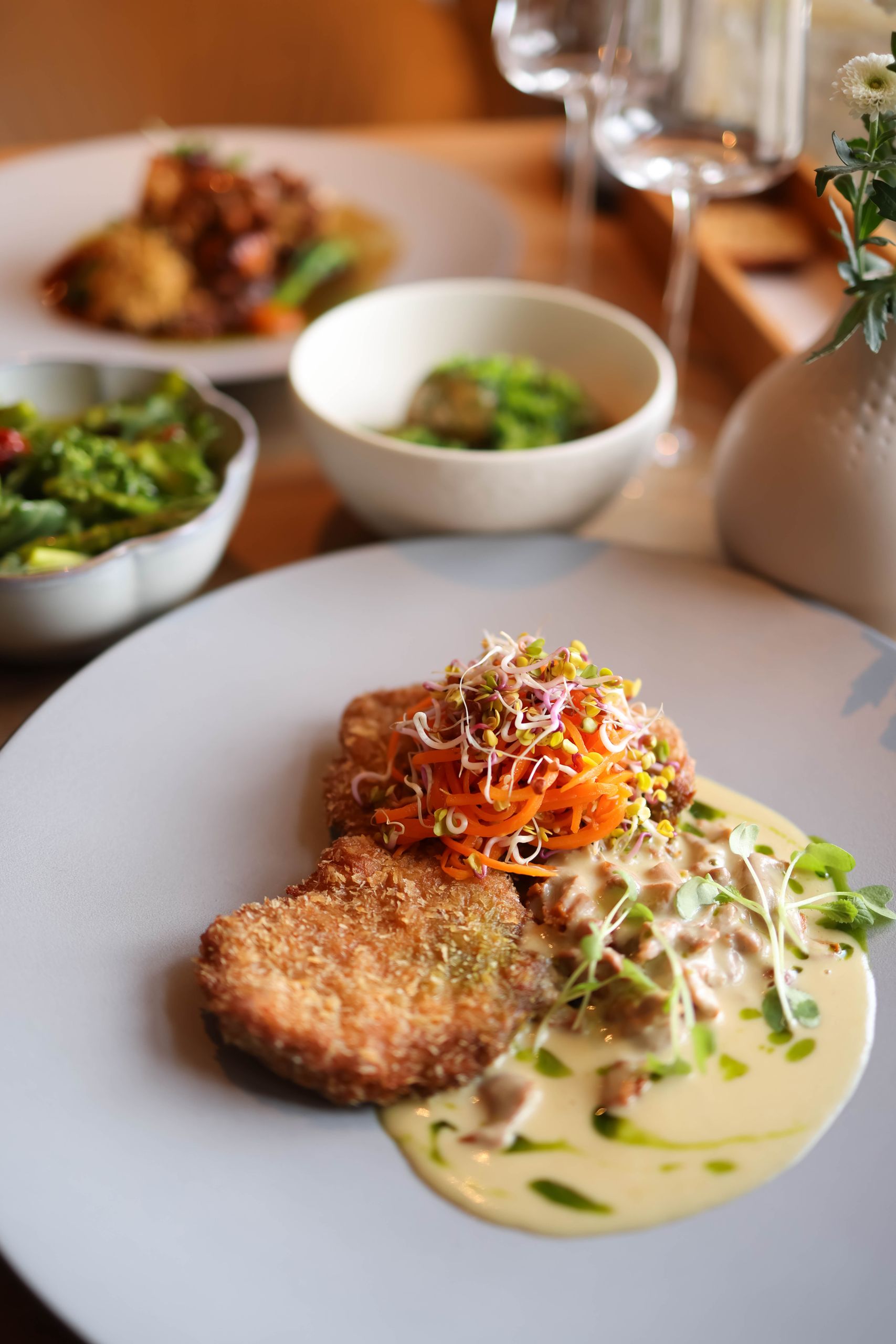 A delicious gourmet vegetable dish served with creamy sauce, perfect for culinary delights.