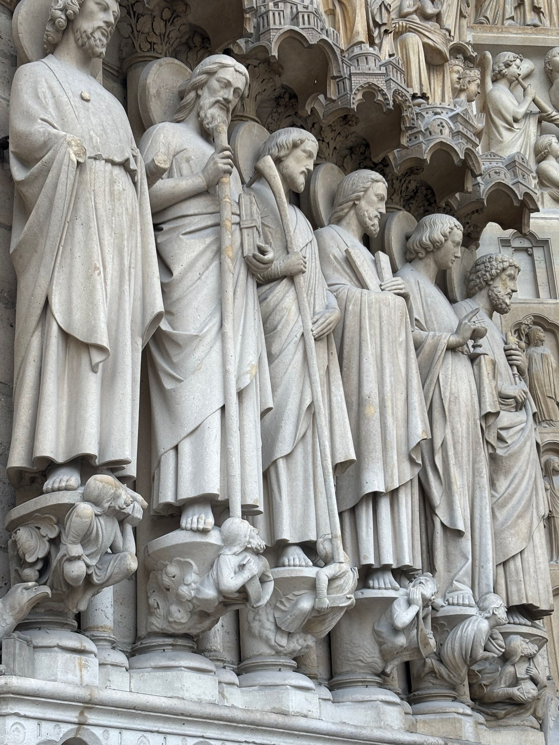 Close-up of exquisite Gothic sculptures at Notre-Dame Cathedral, Paris.