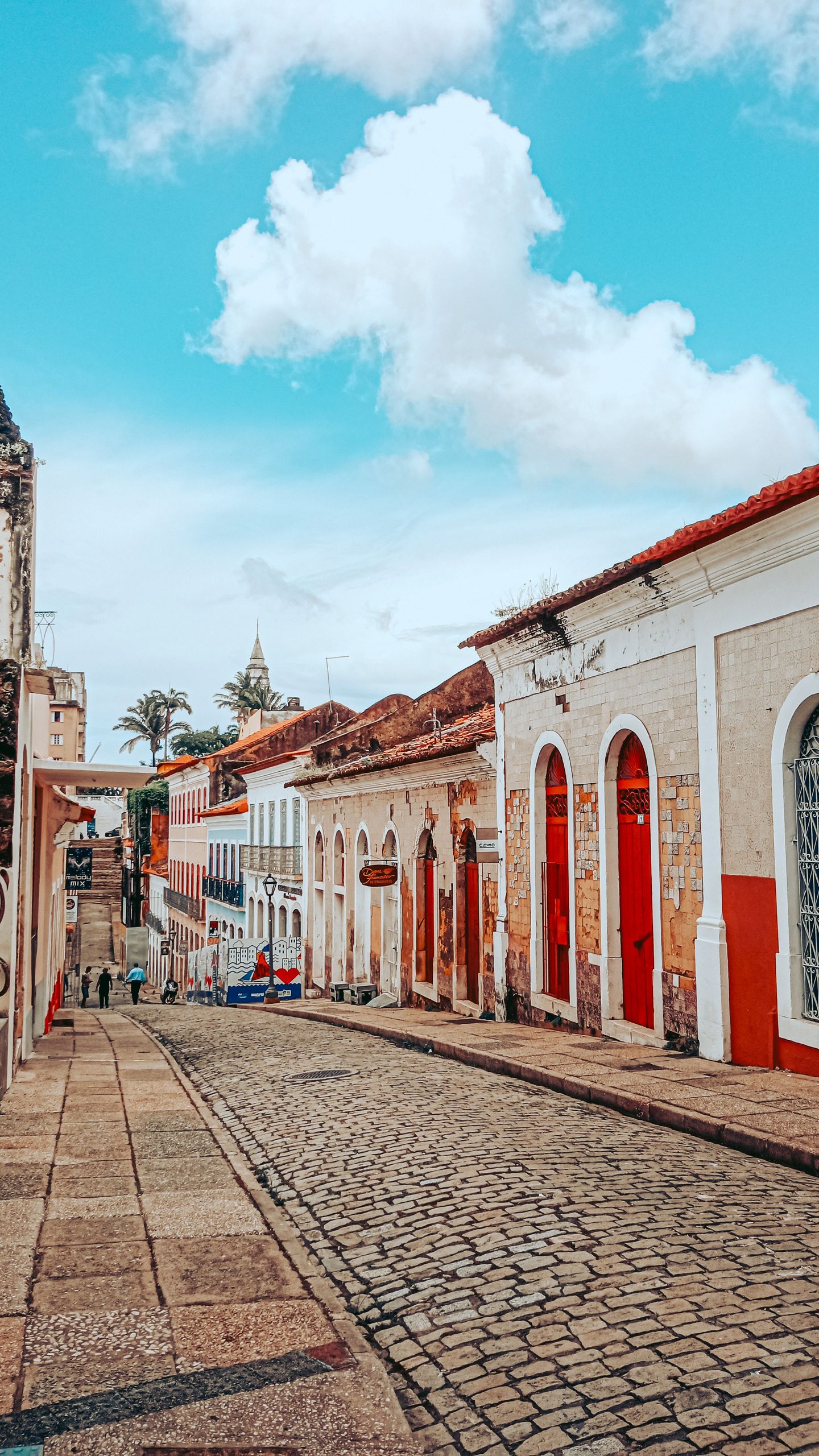 Explore the picturesque cobblestone streets and colorful townhouses of São Luís, MA, Brazil.