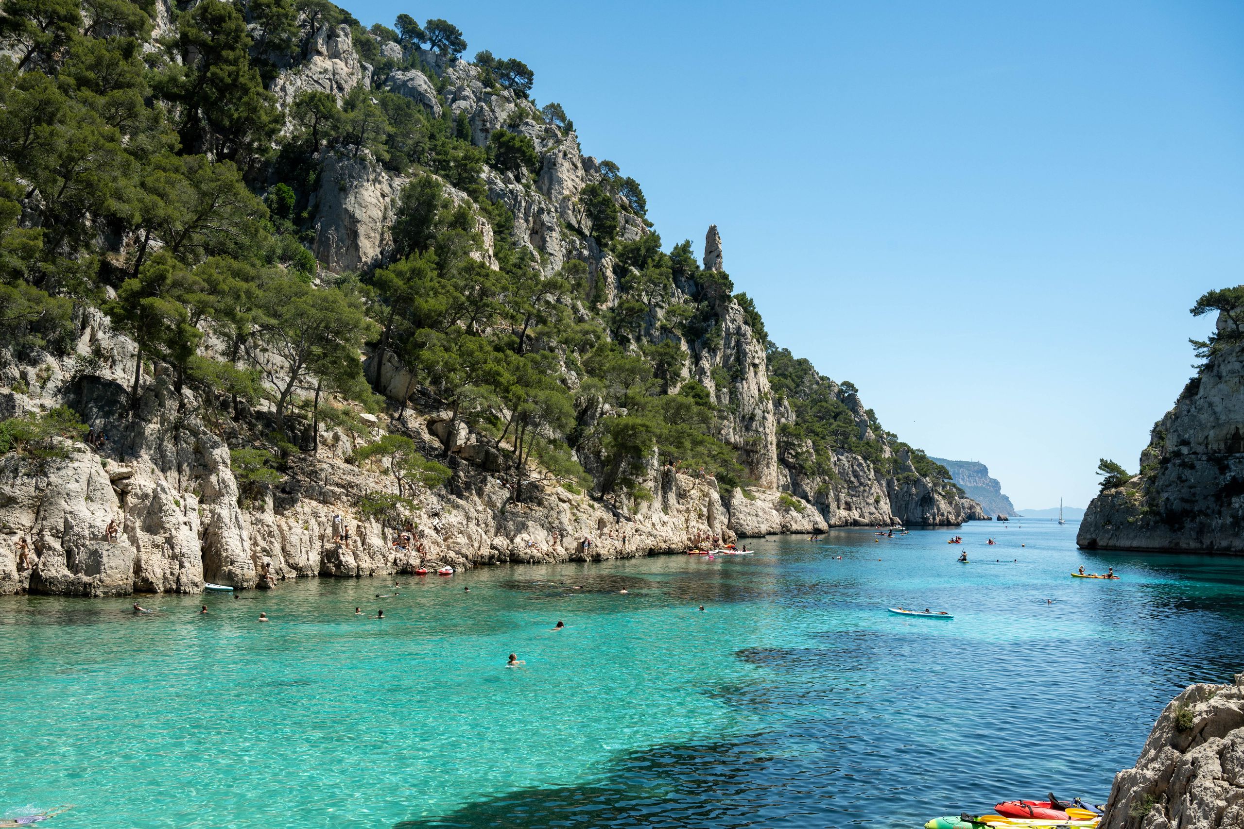 Explore the stunning Calanques in Provence featuring turquoise waters and towering cliffs.