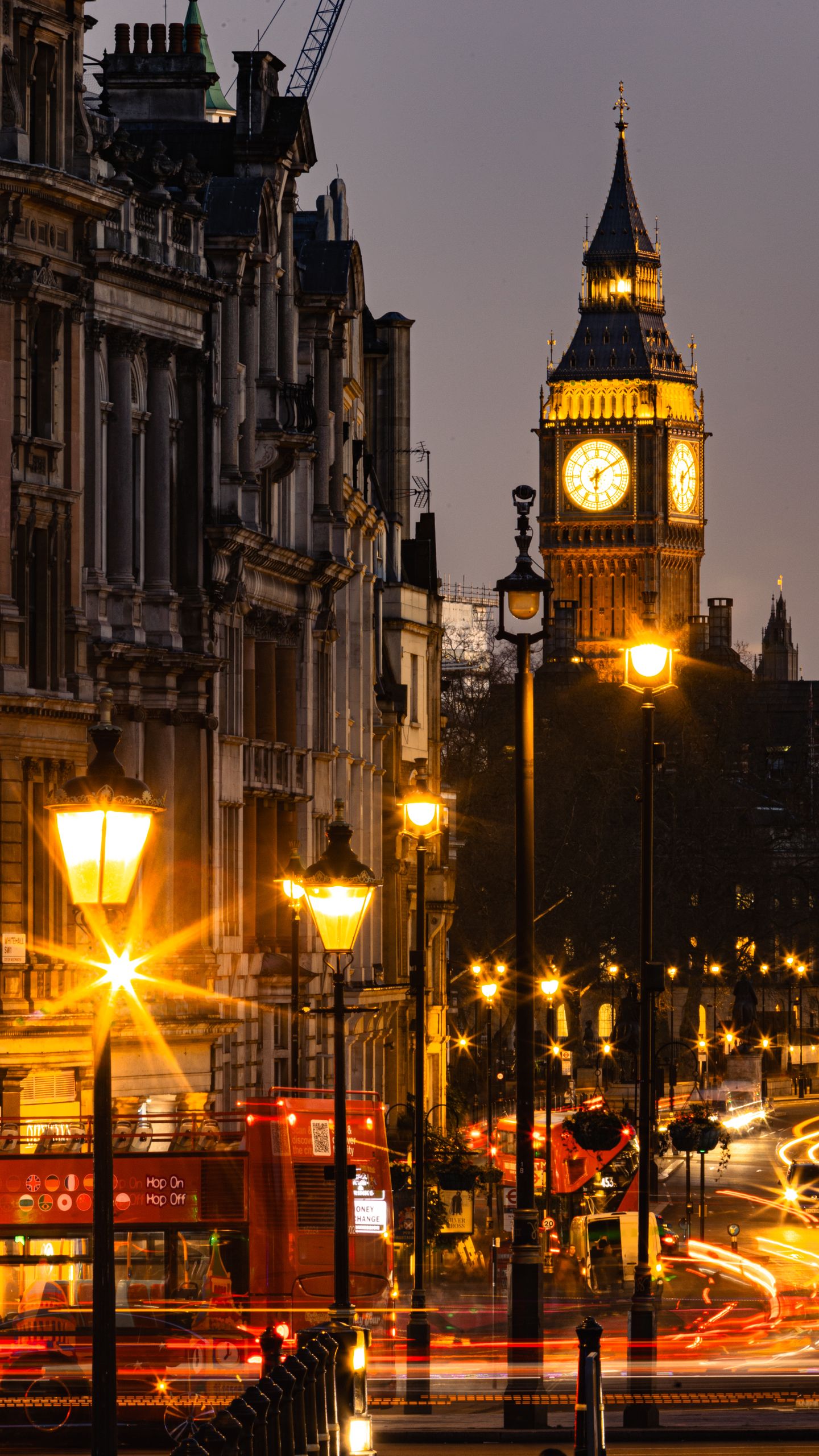 Stunning evening shot of Big Ben with vibrant city lights in London.